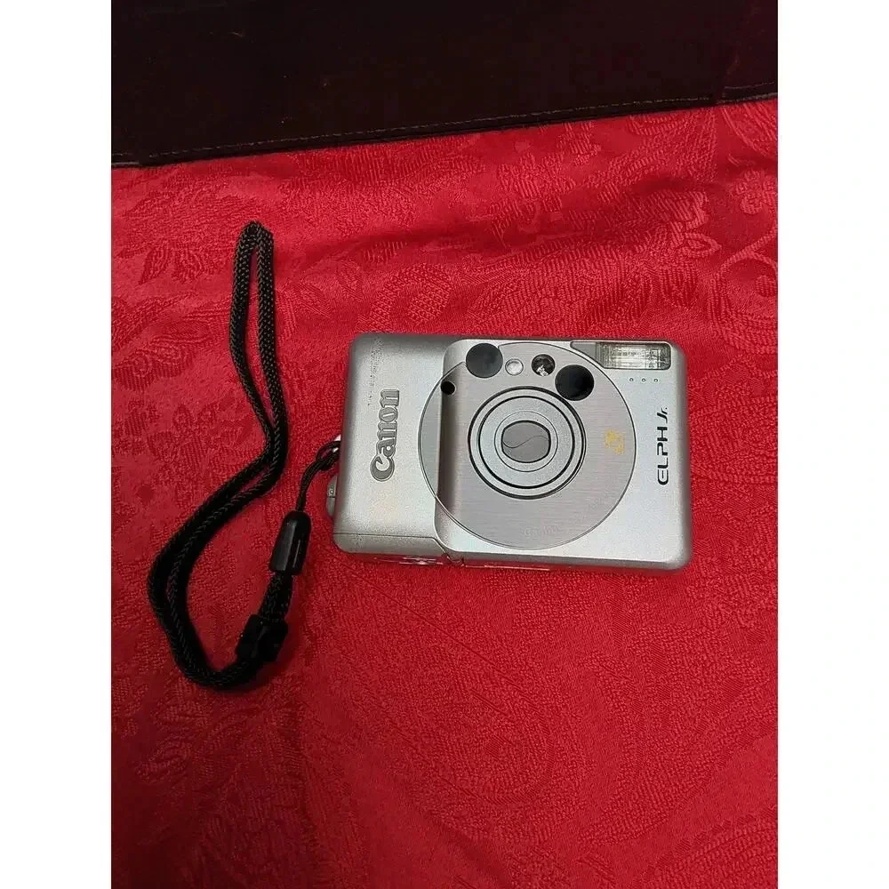 Camera by Canon model lX240 ELPH JR. Includes soft case working Film Camera